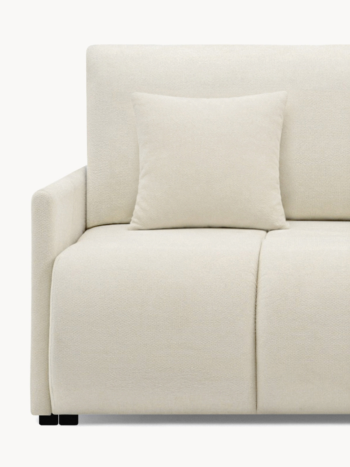 Kanapa Capri z funkcją spania w jasnym kolorze z poduszką i czarnymi nóżkami, widok z boku